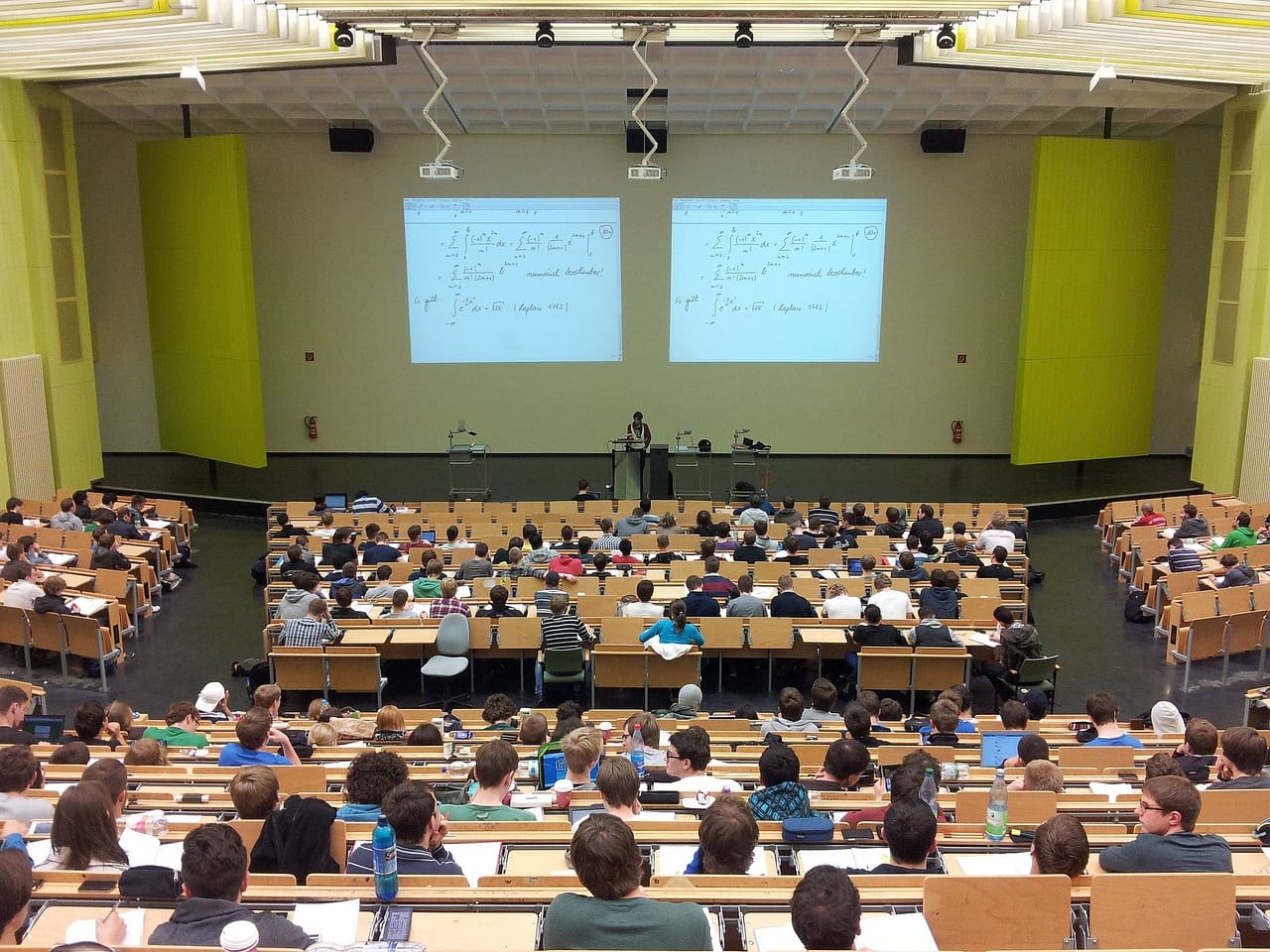 A large group of people in a lecture hall.